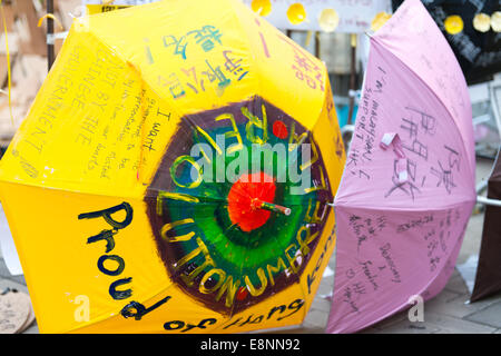 Hong Kong. 12th October, 2014. Hong Kong Protests Yellow umbrellas have become the symbol of the Hong Kong protests and are found all over the Admiralty are including  in front of the Government offices at Tamar Admiralty. Stock Photo
