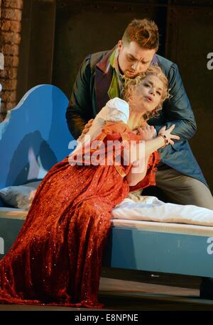Leipzig, Germany. 09th Oct, 2014. A photo of the dress rehearsal shows Olena Tokar as Marguerite and Mirko Roschkowski as Faust acting in Charles Gounod's 'Faust' in the Opera house in Leipzig, Germany, 09 October 2014. The Opera, which premieres on 11 October 2014, is the musical kick-off within the framework of the 1000th anniversary of the city Leipzig in 2015. Photo: Waltraud Grubitzsch/ZB/dpa/Alamy Live News Stock Photo