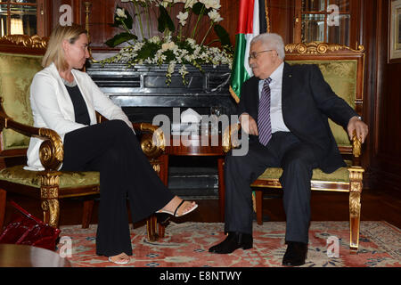 Cairo, Egypt. 12th Oct, 2014. Palestinian president Mahmud Abbas (R) meets with Italian foreign minister Federica Mogherini on the sidelines of the opening session of the Gaza Donor Conference in Cairo on October 12, 2014, aimed at helping the Gaza Strip pummelled by the 50-day war between Israel and Hamas militants earlier this year. Credit:  ZUMA Press, Inc./Alamy Live News Stock Photo