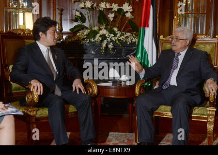 Cairo, Egypt. 12th Oct, 2014. Palestinian president Mahmud Abbas (R) meets with Japanese Minister of Foreign Affairs Fumio Kishida on the sidelines of the opening session of the Gaza Donor Conference in Cairo on October 12, 2014, aimed at helping the Gaza Strip pummelled by the 50-day war between Israel and Hamas militants earlier this year. Credit:  ZUMA Press, Inc./Alamy Live News Stock Photo