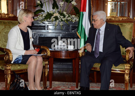 Cairo, Egypt. 12th Oct, 2014. Palestinian president Mahmud Abbas (R) meets with Foreign Minister of Sweden Margot Wallstroem on the sidelines of the opening session of the Gaza Donor Conference in Cairo on October 12, 2014, aimed at helping the Gaza Strip pummelled by the 50-day war between Israel and Hamas militants earlier this year. Credit:  ZUMA Press, Inc./Alamy Live News Stock Photo