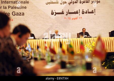 Cairo, Egypt. 12th Oct, 2014. Palestinian president Mahmud Abbas (L) and Egyptian President Abdel Fattah al-Sisi attend the opening session of the Gaza Donor Conference in Cairo on October 12, 2014, aimed at helping the Gaza Strip pummelled by the 50-day war between Israel and Hamas militants earlier this year. Credit:  ZUMA Press, Inc./Alamy Live News Stock Photo