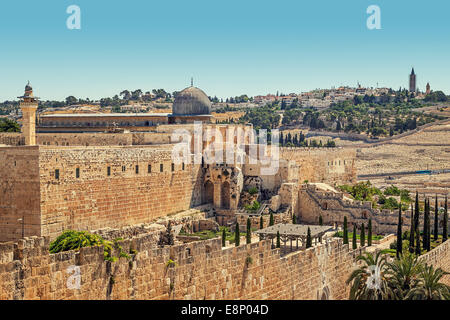 Minaret and dome of Al-Aqsa Mosque surrounded by ancient walls in Jerusalem, Israel. Stock Photo