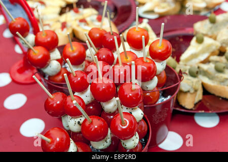 cherry tomatoes with cheese on a stick, canapes party Stock Photo