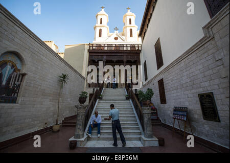 Cairo, Egypt. 12th Oct, 2014. Tourists are seen in front of the hanging Coptic church in Cairo, Egypt, Oct. 12, 2014. The centuries-old church was reopened on Oct. 11 after 16 years of renovation. Credit:  Pan Chaoyue/Xinhua/Alamy Live News Stock Photo