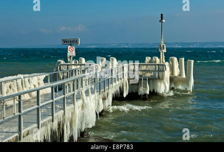 Ice-covered jetty in the Lake Geneva, Versoix near Geneva, Canton of Geneva, Switzerland Stock Photo