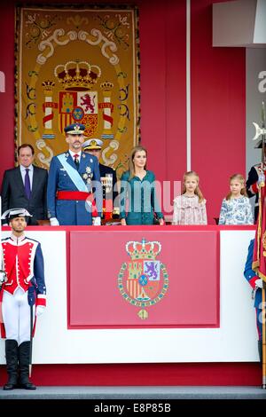 Madrid, Spain. 12th Oct, 2014. (3rd L-R) Spanish King Felipe VI, Queen Letizia and her daughters, Princesses Leonor and Sofia attend the military parade at the National Day in Madrid, Spain, 12 October 2014. Credit:  dpa picture alliance/Alamy Live News Stock Photo