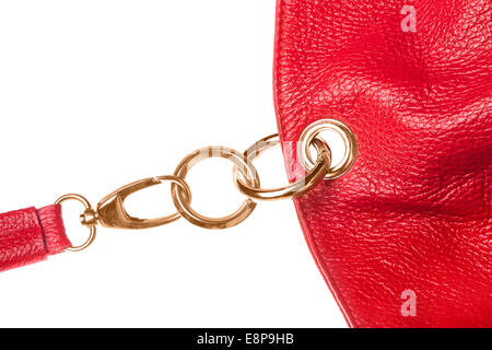 Red leather bag details connected by metal rings isolated on white Stock Photo