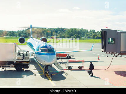 Passenger plane maintenance in airport before flight. Stock Photo