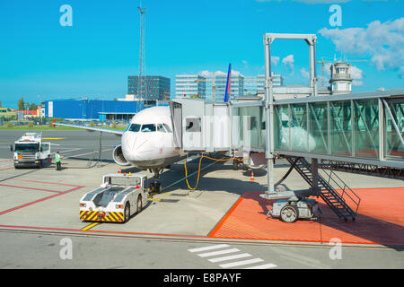 Passenger plane maintenance in airport before flight. Stock Photo