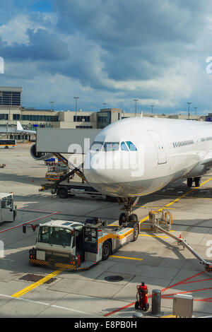 Passenger plane maintenance in airport before flight. Stock Photo