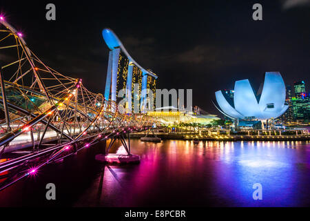 SINGAPORE-MARCH 21: The 6.3 biliion dollar (US) Marina Bay Sands Hotel dominates the skyline at Marina Bay behind the  Esplanade Stock Photo