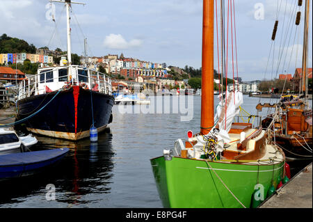 Bristol City Docks flouting harbour, boats moored in Underfall Yard with Hotwells and city centre further down the harbour, UK Stock Photo