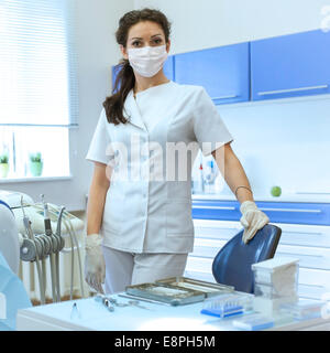 Portrait of woman dentist in mask at her office Stock Photo