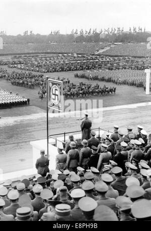 Nuremberg Rally 1937 in Nuremberg, Germany - Nazi party rally grounds - Demonstration by the Nazi armed forces (Wehrmacht) on Zeppelin Field, here speech by Adolf Hitler. On the right behind Hitler: Minister of War General Field Marshal Werner von Blomberg. (Flaws in quality due to the historic picture copy) Fotoarchiv für Zeitgeschichtee - NO WIRE SERVICE - Stock Photo