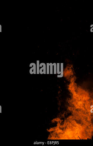 Large bonfire against a black night's sky making incredible shapes Stock Photo