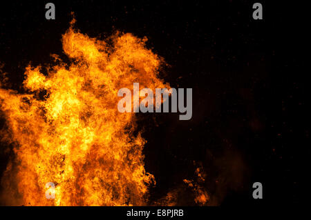 Large bonfire against a black night's sky making incredible shapes Stock Photo
