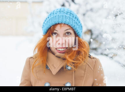 Portrait of a Happy smiling young woman in the winter scenery Stock Photo