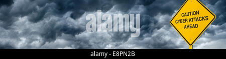 A Caution Sign in Front of Storm Clouds Warning of "Cyber Attacks." Wide Angle, panoramic view for web and billboards. Stock Photo