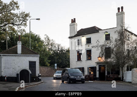 LONDON, UK - OCT 11: The Spaniards Inn on the right and the tollhouse on the left in Hampstead in London on October 11, 2014. Stock Photo