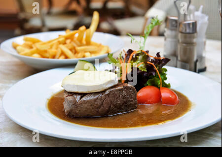 A delicious thick rump steak with Camembert cheese on top and salad, Prague, Czech Republic. Stock Photo