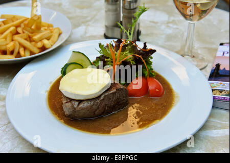 A delicious thick rump steak with Camembert cheese on top and salad, Prague, Czech Republic. Stock Photo