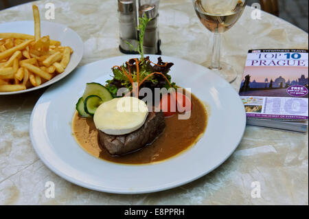 A delicious thick rump steak with Camembert cheese on top and salad, Prague, Czech Republic. Stock Photo