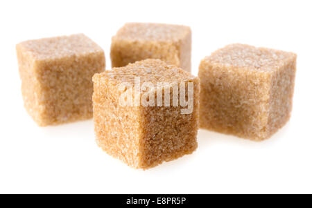 Food: group of four cane sugar cubes, isolated on white background Stock Photo