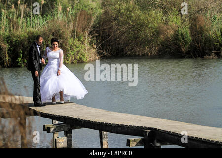 Israel, Northern District Ein Afek Nature Reserve on the Naaman River. Bride and groom being photographed Stock Photo