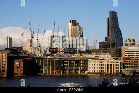 London UK  - View across River Thames towards city of London office blocks and cranes Stock Photo