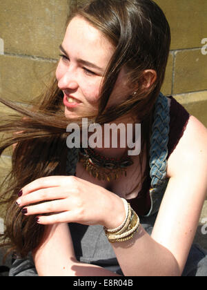 Portrait of 17 year old girl in sunshine with wind blown hair Stock Photo