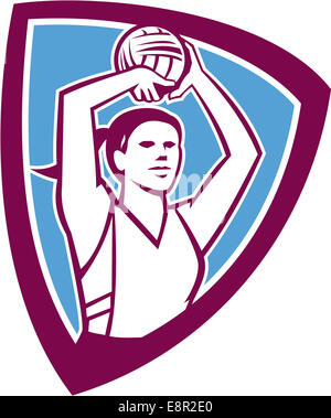 Illustration of a netball player shooting ball set inside shield crest on isolated background done in retro style. Stock Photo