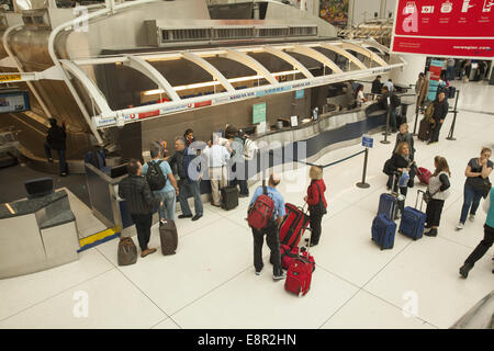 International airline ticket counters in the departures area at JFK Airport in New York City. Stock Photo