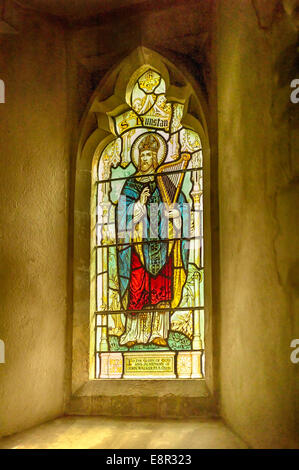 St Dunstan portrayed in stained glass in Sussex UK Stock Photo