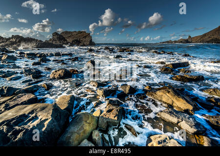 Incoming tide over rocks at Hartland Quay, Cornwall Stock Photo