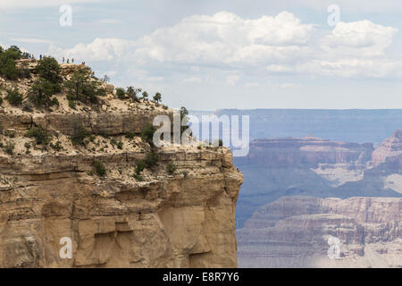 People (on the left upper corner) viewing the Grand Canyon. Grand Canyon National Park, Arizona, USA Stock Photo