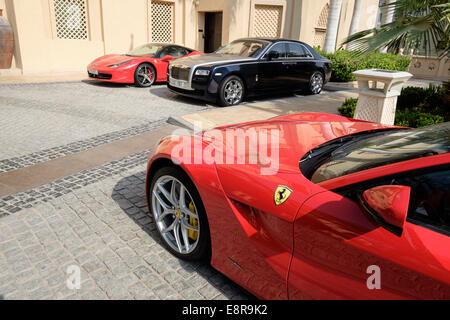 Luxury cars parked outside 5-star hotel in Dubai United Arab Emirates Stock Photo