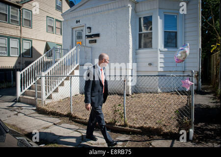 Irvington, New Jersey, USA. 12th Oct, 2014. An unidentified member of the Essex County Prosecutor's Office looks over the the scene where a 15-month-old girl was killed by a stray bullet yesterday afternoon in a second floor apartment at 84 Ellis Avenue, Saturday, Oct. 12, 2014. © Bryan Smith/ZUMA Wire/Alamy Live News Stock Photo
