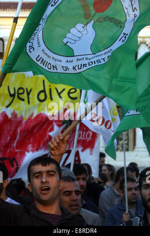 Athens, Greece. 13th Oct, 2014. Kurdish men living in Greece protest during a pro-Kurd demonstration against attacks launched by Islamic State militants targeting the Syrian city of Kobane and the lack of action by the Turkish government in central Athens, Greece, on Oct. 13, 2014. Intensified air strikes helped Kurdish militias pushed back Islamic State militants' fighting for Kobane as pressure mounted for more international action to save the key Syrian border town. Credit:  Marios Lolos/Xinhua/Alamy Live News Stock Photo