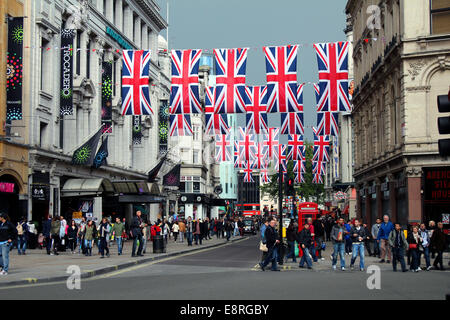 Union flags flying between buildings in Coventry Street, central London, on 15th May, 2012. Stock Photo