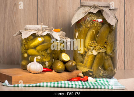 pickled gherkins in jars of home canning Stock Photo