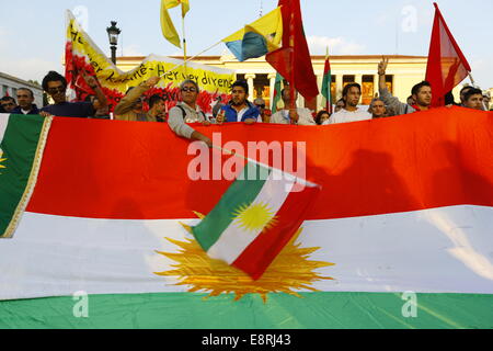 Athens, Greece. 13th Oct, 2014. Protesters wave a Kurdish flag. Kurds living in Greece protested against the attacks of the Islamic State (IS) on the city of Kobane in Syria. Their anger was mostly directed towards Turkey, and the inactivity of the Turkish Army to come to the aid of the besieged city. Credit:  Michael Debets/Pacific Press/Alamy Live News Stock Photo