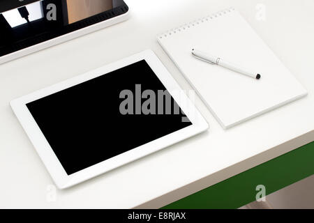 Workplace with tablet and keyboard, pen Stock Photo