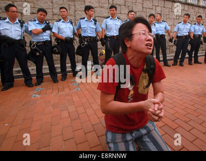 Hong Kong, China. 2nd Oct, 2014. Pro-democracy activists and police scuffle outside the Chief Executive's office. The protesters surrounded key government buildings in the territory as police warn they will 'decisively uphold the law.' (Credit Image: © Stephen Shaver/zReportage.com via ZUMA Press) Stock Photo