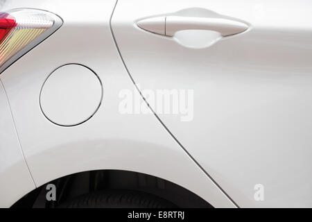 door and tyre and petrol cap cover and light of a car Stock Photo