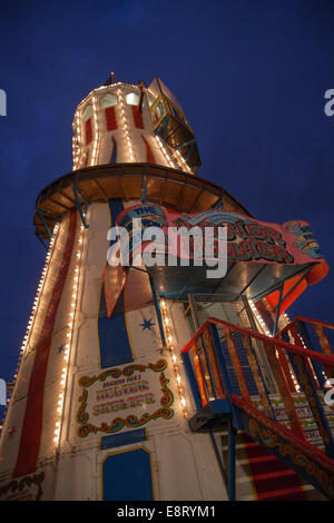 The Brighton Pier fairground at night. Stock Photo