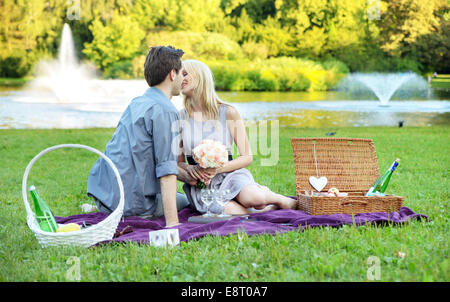 Young couple on the very romantic date in the park Stock Photo