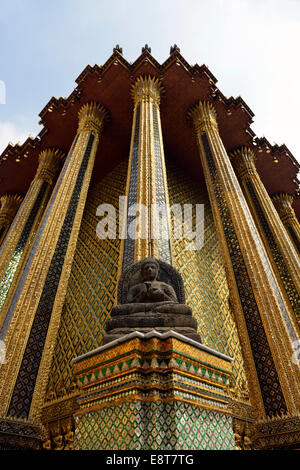 Buddha statue in front of the Mondop, a library, Wat Phra Kaeo Temple, Grand Palace, Bangkok, Thailand Stock Photo