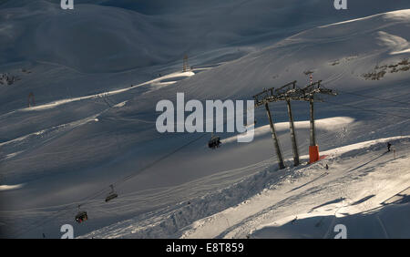 Skiers in chairlift, Zugspitze, Bavaria, Germany Stock Photo