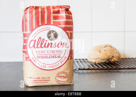 Bag of Allinson Very Strong Wholemeal Flour for making bread on a kitchen surface Stock Photo